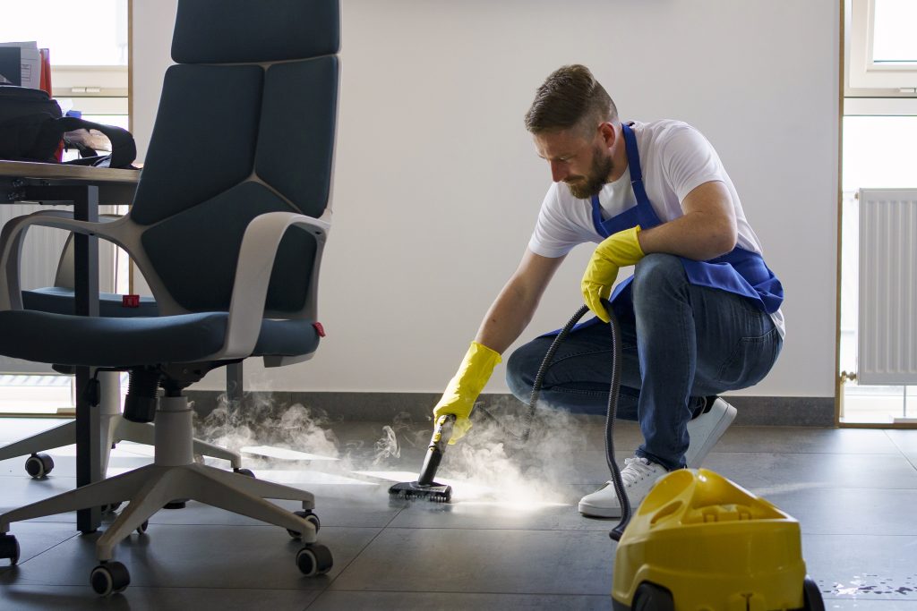 professional-cleaning-service-person-using-steam-cleaner-office-1024x683.jpg